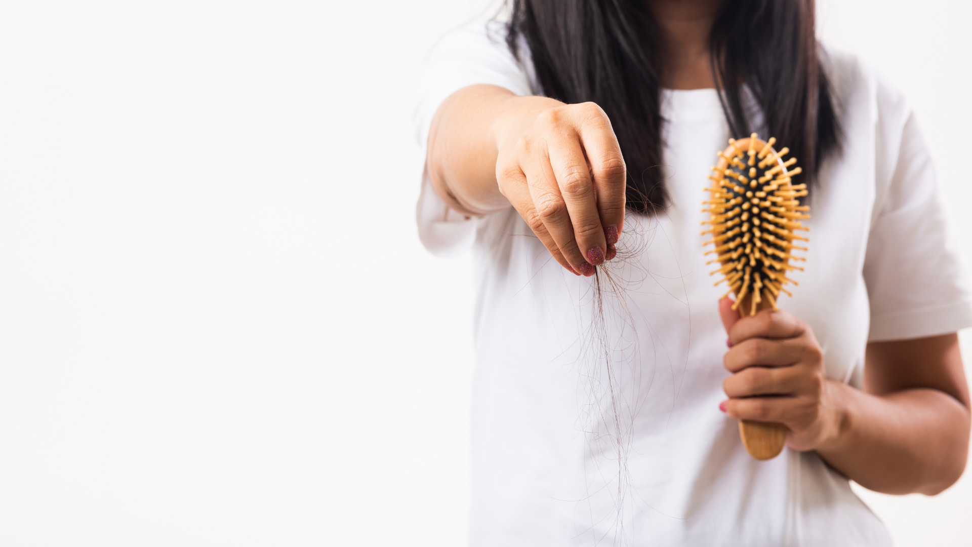 An image of a woman suffering from hair fall