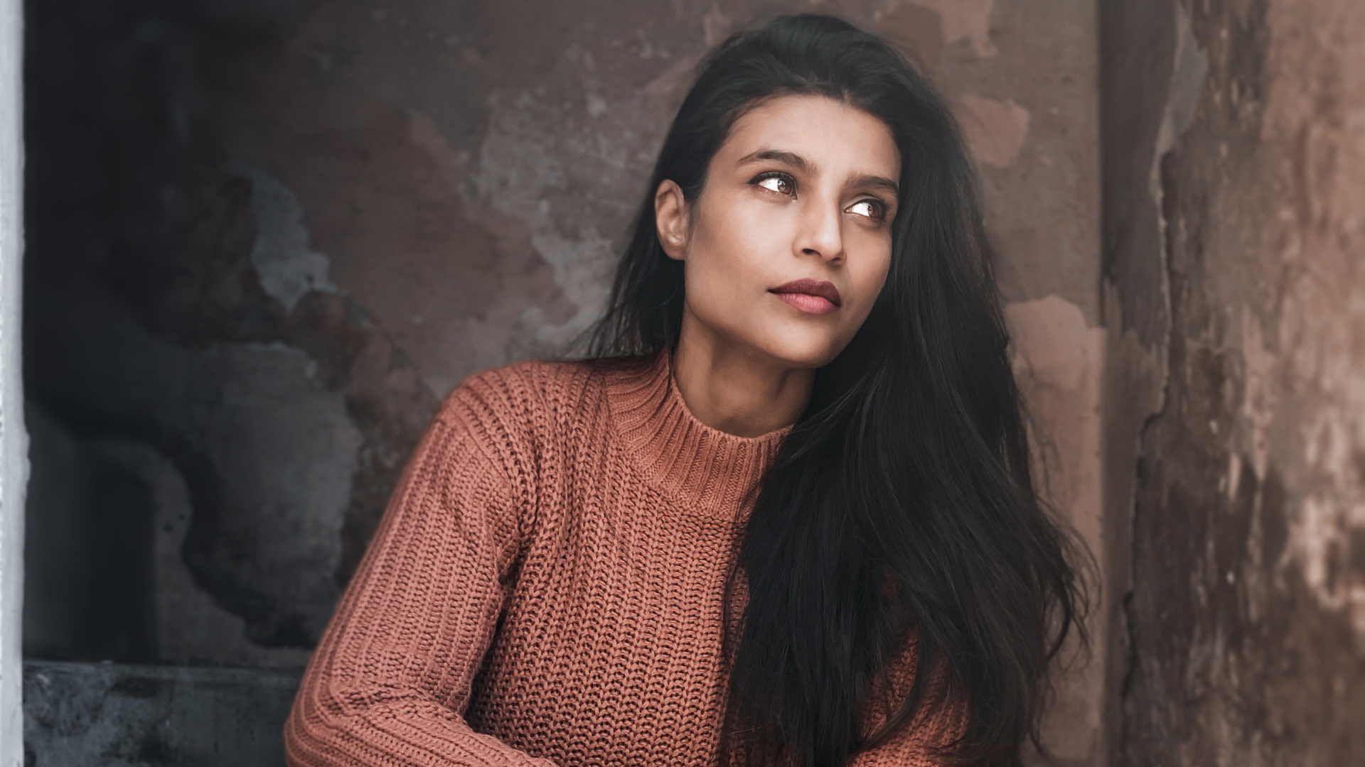 An image of a woman showing off her long and shiny hair.