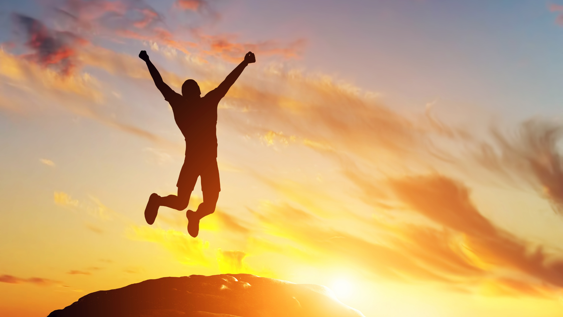 An image of a man jumping happily after getting relief from back pain
