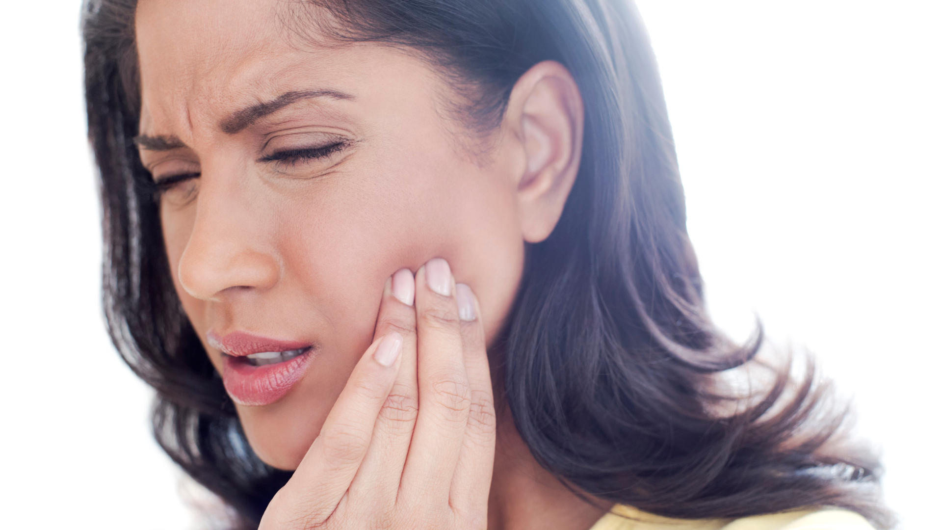 An image of a woman suffering from Tooth pain.